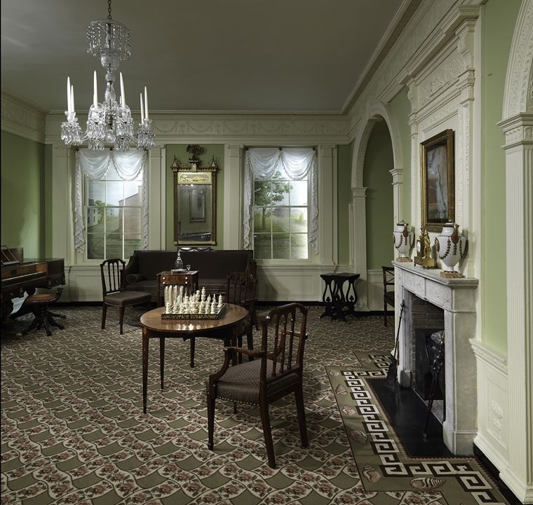 The Benkard Room as installed at the Met, complete with historically appropriate furniture, a chess set, fireplace, and chandelier.