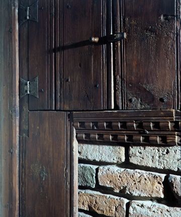 Bead molding on the boards of the Hart Room fireplace wall