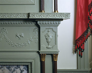 Detail of the mantel in the Haverhill Room showing an Etruscan scroll