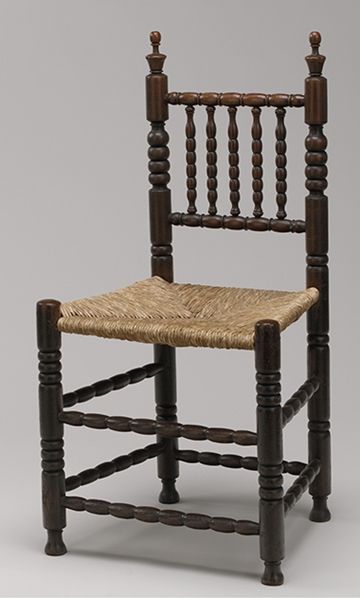Dark wood char with wicker seat.