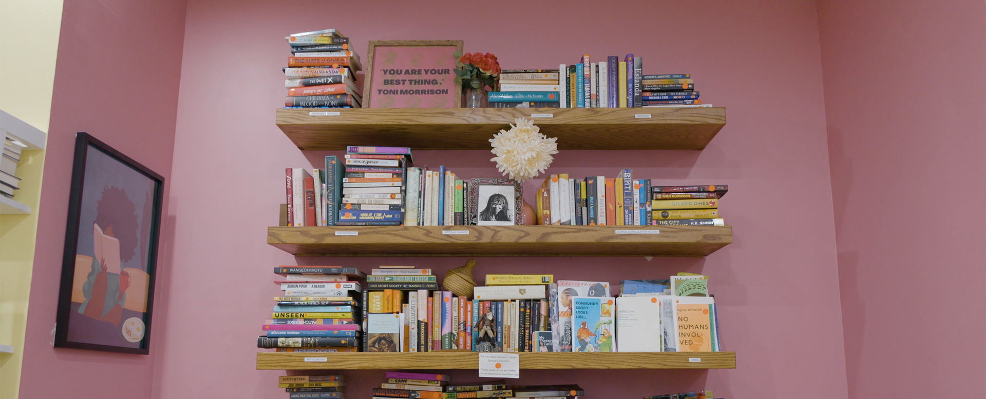 Floating shelves filled with books at the Free Black Women's Library.