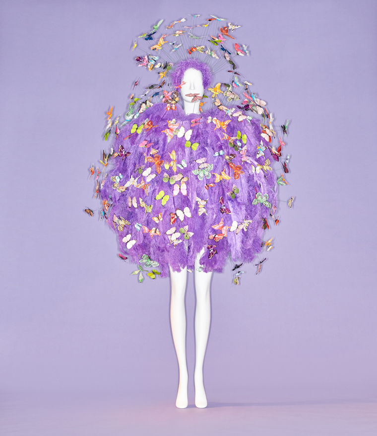 Couture ensemble of purple feathers adorned with bejeweled butterflies